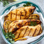 These easy grilled lemon pepper chicken breasts are perfect for a simple weeknight dinner or to meal prep your protein for the week. With only a few ingredients, they cook quickly without much hands on time or dirty dishes. These Whole30 grilled chicken breasts are juicy with a bright lemon flavor that pairs well with a little kick from the pepper. It's a family friendly recipe that is gluten-free, low carb and paleo so they can please a crowd, too! #whole30grilling #grilledchicken #ketochicken #whole30chicken