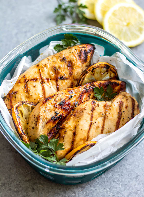 These easy grilled lemon pepper chicken breasts are perfect for a simple weeknight dinner or to meal prep your protein for the week. With only a few ingredients, they cook quickly without much hands on time or dirty dishes. These Whole30 grilled chicken breasts are juicy with a bright lemon flavor that pairs well with a little kick from the pepper. It's a family friendly recipe that is gluten-free, low carb and paleo so they can please a crowd, too! #whole30grilling #grilledchicken #ketochicken #whole30chicken