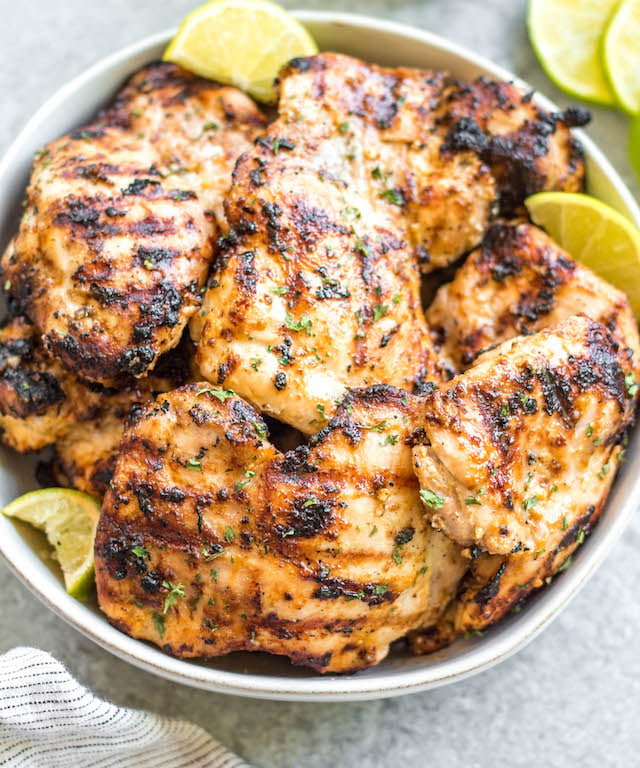 This easy mayo marinated grilled chicken thighs recipe is such a tasty way to grill an easy weeknight dinner or use for a meal prep recipe! This is the best mayo chicken marinade, and leaves the chicken so juicy and full of flavor. This is also a paleo, low carb, Whole30 chicken recipe so everyone in the family can enjoy it! With only a few simple ingredients and under 20 minutes, this will be your new go-to way to grill thighs. #whole30grill #mayomarinade #mayochicken #chickenmarinade #ketochicken