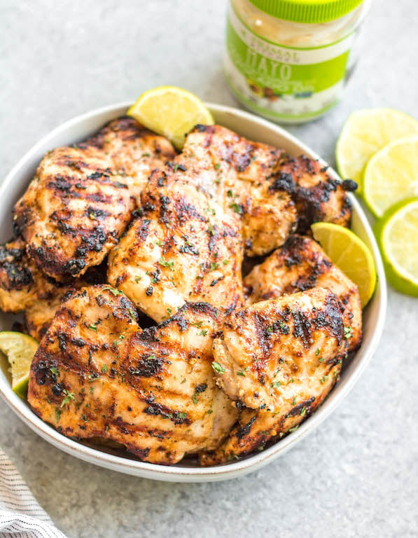 This easy mayo marinated grilled chicken thighs recipe is such a tasty way to grill an easy weeknight dinner or use for a meal prep recipe! This is the best mayo chicken marinade, and leaves the chicken so juicy and full of flavor. This is also a paleo, low carb, Whole30 chicken recipe so everyone in the family can enjoy it! With only a few simple ingredients and under 20 minutes, this will be your new go-to way to grill thighs. #whole30grill #mayomarinade #mayochicken #chickenmarinade #ketochicken