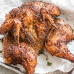 This recipe is for the best smoked butterfly chicken. It'll be your go-to method for smoking a whole chicken on a pellet grill that's Whole30, gluten-free, low carb and paleo. The dry rub is made with simple, sugar-free ingredients and by using the spatchcock method, the chicken skin gets crispy while keeping the meat tender, juicy and full of flavor. This is a great family friendly recipe that works well for meal prep, too. #whole30chicken #smokerrecipes #wholechicken #pelletgrill #butterflychicken