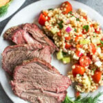 This easy smoked lamb roast is great for entertaining or a special family weekend dinner. It's healthy, quick to prepare and simple to cook on the smoker. It's also Whole30, low carb/keto, gluten-free and paleo, so no matter who's at your dinner table, everyone will enjoy! Seasoned to perfection with spices already in your pantry, this boneless lamb roast is juicy and full of flavor with very little hands on time! #whole30recipes #lambrecipes #smokerrecipes #ketosmoker #paleosmoker #smokedlamb