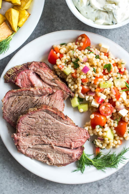 This easy smoked lamb roast is great for entertaining or a special family weekend dinner. It's healthy, quick to prepare and simple to cook on the smoker. It's also Whole30, low carb/keto, gluten-free and paleo, so no matter who's at your dinner table, everyone will enjoy! Seasoned to perfection with spices already in your pantry, this boneless lamb roast is juicy and full of flavor with very little hands on time! #whole30recipes #lambrecipes #smokerrecipes #ketosmoker #paleosmoker #smokedlamb