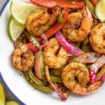 These air fryer shrimp fajitas are great for a quick and easy weeknight dinner, taco night, meal prep, or simple healthy lunch. They are very simple to toss together, with minimal hands on time, and are Whole30, paleo, keto/low carb, and gluten-free! The homemade fajita seasoning adds the perfect flavor to the bell peppers, onion and shrimp! #whole30airfryer #shrimpfajitas #airfryerrecipes #ketoairfryer #whole30shrimp #glutenfree