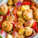 These sweet and sour chicken meatballs are made in the slow cooker, and are paleo, gluten-free and easily made Whole30! It takes less than 20 minutes to prepare, and then the crock pot does the cooking for you. These Whole30 meatballs are perfect for a weeknight dinner, or meal prep for easy, healthy lunches. It's a family friendly recipe that has the flavors you love from your favorite Chinese takeout! #whole30recipes #whole30slowcooker #crockpot #sweetandsour #chickenrecipes