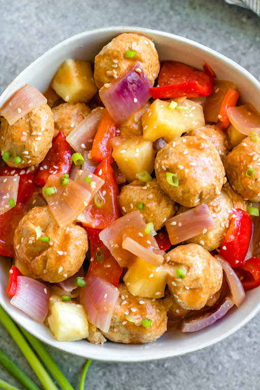 These sweet and sour chicken meatballs are made in the slow cooker, and are paleo, gluten-free and easily made Whole30! It takes less than 20 minutes to prepare, and then the crock pot does the cooking for you. These Whole30 meatballs are perfect for a weeknight dinner, or meal prep for easy, healthy lunches. It's a family friendly recipe that has the flavors you love from your favorite Chinese takeout! #whole30recipes #whole30slowcooker #crockpot #sweetandsour #chickenrecipes