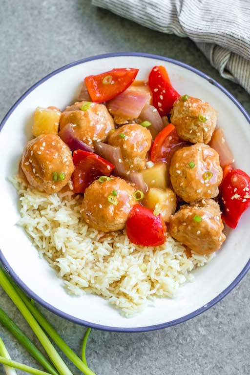 These sweet and sour chicken meatballs are made in the slow cooker, and are paleo, gluten-free and easily made Whole30! It takes less than 20 minutes to prepare, and then the crock pot does the cooking for you. These Whole30 meatballs are perfect for a weeknight dinner, or meal prep for easy, healthy lunches. It's a family friendly recipe that has the flavors you love from your favorite Chinese takeout! #whole30recipes #whole30slowcooker #crockpot #sweetandsour #chickenrecipes