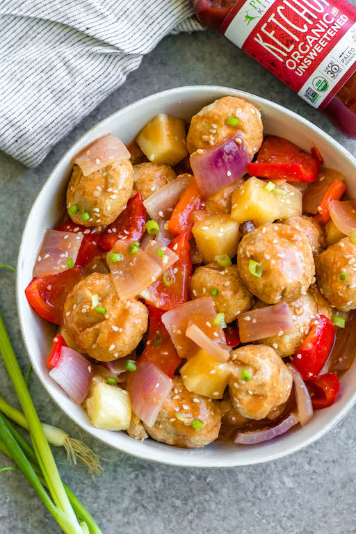 These sweet and sour chicken meatballs are made in the slow cooker, and are paleo, gluten-free and easily made Whole30! It takes less than 20 minutes to prepare, and then the crock pot does the cooking for you. These Whole30 meatballs are perfect for a weeknight dinner, or meal prep for easy, healthy lunches. It's a family friendly recipe that has the flavors you love from your favorite Chinese takeout! #whole30recipes #whole30slowcooker #crockpot #sweetandsour #chickenrecipes