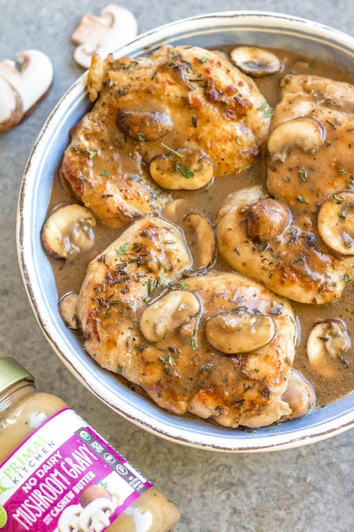 This easy chicken thighs and mushroom skillet is a 30 minute one pan meal that's ideal for busy weeknights! It's full of flavor from a creamy, rich gravy, while still being Whole30, paleo, gluten-free, and dairy-free! There's only a few simple ingredients which makes this dish come together quickly, and it's great for a healthy meal prep recipe because it reheats incredibly well. This is a family-friendly recipe everyone will love! #onepan #whole30chicken #chickenthighs #mushroomrecipes #paleorecipes #glutenfreechicken #weeknightchicken