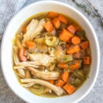 This easy turkey soup is perfect for using up leftover turkey, especially those Thanksgiving turkey leftovers! This soup cooks on the stovetop in about 30 minutes, is a great use for leftover herbs you have, and is Whole30, Paleo, gluten-free and dairy-free. Along with being family-friendly Whole30 soup recipe, it also is freezer-friendly, so you can save it to enjoy turkey beyond the holiday season! #leftoverturkey #whole30soup #holidayrecipes #turkeysoup #whole30soup