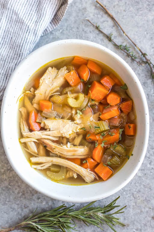 This easy turkey soup is perfect for using up leftover turkey, especially those Thanksgiving turkey leftovers! This soup cooks on the stovetop in about 30 minutes, is a great use for leftover herbs you have, and is Whole30, Paleo, gluten-free and dairy-free. Along with being family-friendly Whole30 soup recipe, it also is freezer-friendly, so you can save it to enjoy turkey beyond the holiday season! #leftoverturkey #whole30soup #holidayrecipes #turkeysoup #whole30soup