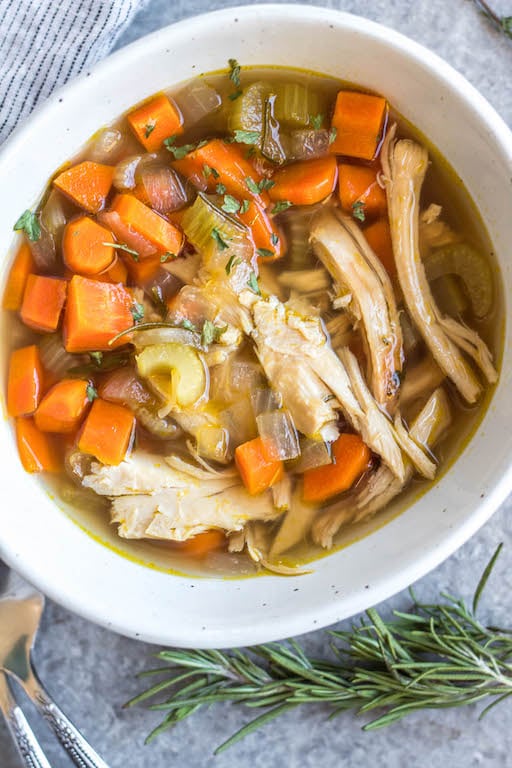 This easy turkey soup is perfect for using up leftover turkey, especially those Thanksgiving turkey leftovers! This soup cooks on the stovetop in about 30 minutes, is a great use for leftover herbs you have, and is Whole30, Paleo, gluten-free and dairy-free. Along with being family-friendly Whole30 soup recipe, it also is freezer-friendly, so you can save it to enjoy turkey beyond the holiday season! #leftoverturkey #whole30soup #holidayrecipes #turkeysoup #whole30soup