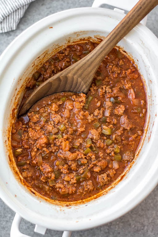 This easy recipe for slow cooker sloppy joes is so simple, but so full of the flavors we know and love! It's perfect for meal prep, easy weeknight meals, family gatherings or football parties, and so much more. The best is that it's Whole30, paleo, gluten-free, and made without sugar so everyone can enjoy! Cooking in the slow cooker makes it great for guests to serve themselves, or to bring to a potluck, and it's a budget friendly ground beef recipe that will be a family favorite! #whole30sloppyjoes #whole30groundbeef #whole30beefrecipes #slowcookerbeef #paleogroundbeef