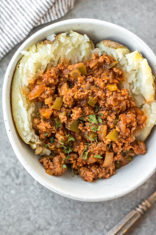 This easy recipe for slow cooker sloppy joes is so simple, but so full of the flavors we know and love! It's perfect for meal prep, easy weeknight meals, family gatherings or football parties, and so much more. The best is that it's Whole30, paleo, gluten-free, and made without sugar so everyone can enjoy! Cooking in the slow cooker makes it great for guests to serve themselves, or to bring to a potluck, and it's a budget friendly ground beef recipe that will be a family favorite! #whole30sloppyjoes #whole30groundbeef #whole30beefrecipes #slowcookerbeef #paleogroundbeef