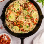 This Whole30 coconut lime chicken skillet is a gluten free, dairy free, and paleo chicken recipe that is made all in one pan! The creamy coconut sauce and chicken breasts are perfectly seasoned with lime, onion, cilantro and garlic. It all comes together in about 30 minutes, and is great for an easy Whole30 dinner that's family friendly, or a healthy meal prep recipe for lunches during the week. #coconutchicken #whole30chicken #whole30skillet #onepanmeal