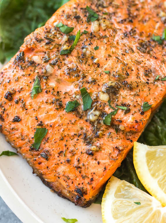 This oven baked Whole30 Greek salmon recipe is an easy way to meal prep or make a quick weeknight meal. It bakes in 15 minutes or cooks in the air fryer in just 10 minutes. This Whole30 salmon is also gluten free, low carb and paleo, so everyone can enjoy it! Lemon juice and a blend of spices like oregano, dill and basil in the marinade will ensure your salmon is bursting with flavor. #whole30salmon #greeksalmon #airfryersalmon #ovenbakedsalmon