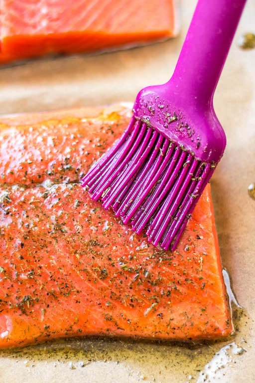 This oven baked Whole30 Greek salmon recipe is an easy way to meal prep or make a quick weeknight meal. It bakes in 15 minutes or cooks in the air fryer in just 10 minutes. This Whole30 salmon is also gluten free, low carb and paleo, so everyone can enjoy it! Lemon juice and a blend of spices like oregano, dill and basil in the marinade will ensure your salmon is bursting with flavor. #whole30salmon #greeksalmon #airfryersalmon #ovenbakedsalmon