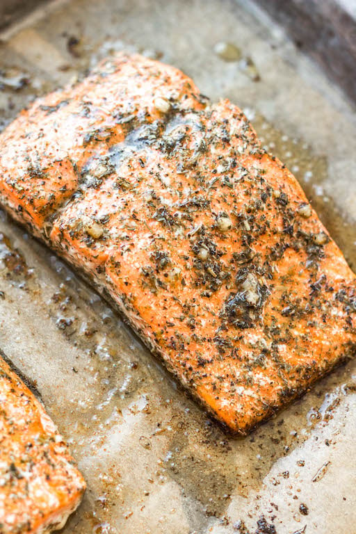 This oven baked Whole30 Greek salmon recipe is an easy way to meal prep or make a quick weeknight meal. It bakes in 15 minutes or cooks in the air fryer in just 10 minutes. This Whole30 salmon is also gluten free, low carb and paleo, so everyone can enjoy it! Lemon juice and a blend of spices like oregano, dill and basil in the marinade will ensure your salmon is bursting with flavor. #whole30salmon #greeksalmon #airfryersalmon #ovenbakedsalmon