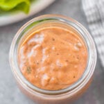 This Whole30 homemade thousand island dressing is so easy to make. It's a smooth, tangy homemade dressing that takes less than 5 minutes to mix together! This DIY dressing is also gluten-free, dairy-free, keto/low carb, and paleo thousand island. It's the perfect addition to salads, burgers, wraps and to dip your fries or veggies in. #whole30dressing #whole30thousandisland #homemadedressing #healthythousandisland