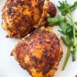 These Whole30 air fryer bone in chicken thighs are so simple and flavorful. The skin gets crispy while the inside stays juicy and tender. They're the perfect option for a quick weeknight dinner and are done in under 30 minutes. Not only are these bone in chicken thighs Whole30, but they're also paleo, gluten free and low carb. #airfryerchicken #whole30airfryer #paleorecipes #glutenfreeairfryer #chickenthighs