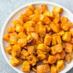 These air fryer roasted sweet potatoes are a quick and easy vegetable side for breakfast, dinner or meal prep. They're Whole30, paleo and gluten-free, and only take 15 minutes! With only 3 ingredients, these air fryer diced sweet potatoes cook in half the time as they would in the oven, and are perfectly crispy every time! #whole30vegetables #airfryer #sweetpotatorecipes #airfryerpotatoes