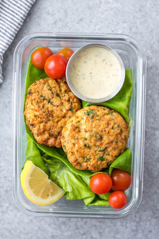 This easy Whole30 air fryer salmon patties are under 10 ingredients, take less than 20 minutes to prep and cook, and are an awesome meal prep recipe. They're also paleo, low carb and keto, and gluten-free! These air fryer patties are made with canned salmon so it's a budget friendly Whole30 recipe made from simple pantry ingredients. #whole30airfryer #whole30salmon #airfryersalmon #salmonpatties #whole30seafood