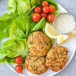 This easy Whole30 air fryer salmon patties are under 10 ingredients, take less than 20 minutes to prep and cook, and are an awesome meal prep recipe. They're also paleo, low carb and keto, and gluten-free! These air fryer patties are made with canned salmon so it's a budget friendly Whole30 recipe made from simple pantry ingredients. #whole30airfryer #whole30salmon #airfryersalmon #salmonpatties #whole30seafood