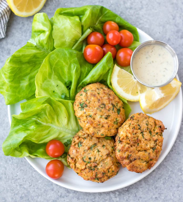 This easy Whole30 air fryer salmon patties are under 10 ingredients, take less than 20 minutes to prep and cook, and are an awesome meal prep recipe. They're also paleo, low carb and keto, and gluten-free! These air fryer patties are made with canned salmon so it's a budget friendly Whole30 recipe made from simple pantry ingredients. #whole30airfryer #whole30salmon #airfryersalmon #salmonpatties #whole30seafood