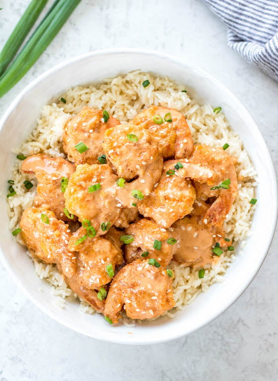 This Whole30 bang bang shrimp recipe is really easy to make but packed with so much flavor! It's a great seafood recipe that's low carb, gluten free, and dairy free. This copycat bang bang shrimp uses coconut flour, buffalo sauce and other common paleo ingredients. It will definitely be a new family favorite Whole30 dinner recipe to spice up your weeknight meals! #whole30bangbang #bangbangshrimp #whole30seafood #shrimprecipes #keto