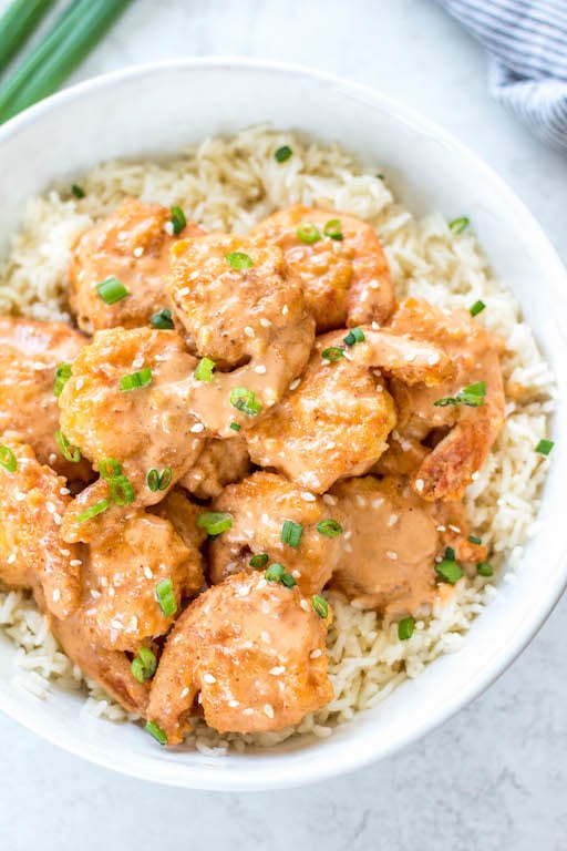 This Whole30 bang bang shrimp recipe is really easy to make but packed with so much flavor! It's a great seafood recipe that's low carb, gluten free, and dairy free. This copycat bang bang shrimp uses coconut flour, buffalo sauce and other common paleo ingredients. It will definitely be a new family favorite Whole30 dinner recipe to spice up your weeknight meals! #whole30bangbang #bangbangshrimp #whole30seafood #shrimprecipes #keto