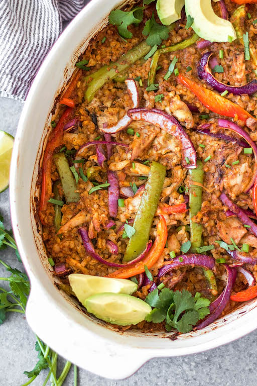 The Chicken Fajita Casserole is a low carb, gluten free and paleo friendly meal that is easy to make and sure to be a hit! It's packed with all of the chicken fajita flavors you love and full of fresh and healthy ingredients like shredded chicken, bell peppers, cauliflower rice, and onions - all wrapped up in a casserole dish! It's perfect for both a weeknight dinner and for meal prep for lunches. This delicious Whole30 casserole is a must try. #chickenfajita #chickencasserole #whole30casserole #whole30chickenrecipes