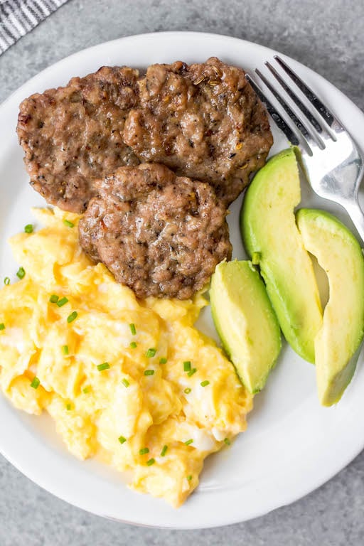 This easy homemade maple breakfast sausage recipe is so simple to make, perfect for meal prepping, and it's freezer friendly! These DIY maple sausages are gluten free, low carb, paleo and only use a few ingredients including ground pork and spices, and only a few minutes time. You can oven bake them or cook them up in a skillet, and they come out delicious every time! #groundporkrecipes #breakfastsausage #freezerrecipes