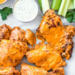 These buffalo chicken thighs are naturally gluten and dairy free. This versatile recipe can be made in both by being baked in the oven and cooked in the air fryer. It is made with a total of 5 staple ingredients you likely already have on hand alongside boneless chicken thighs and your go-to buffalo sauce. They take less than 30 minutes, and make an easy, healthy, dinner everyone will love.