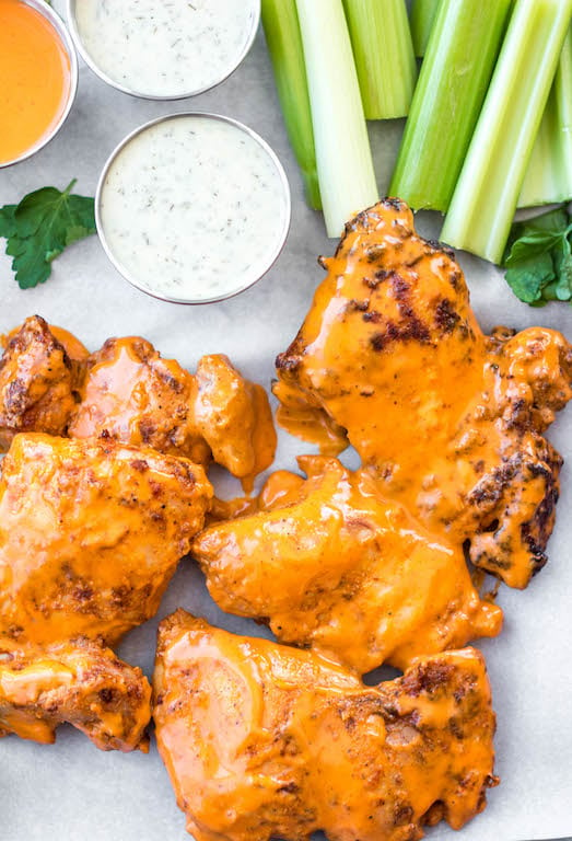 These buffalo chicken thighs are naturally gluten and dairy free. This versatile recipe can be made in both by being baked in the oven and cooked in the air fryer. It is made with a total of 5 staple ingredients you likely already have on hand alongside boneless chicken thighs and your go-to buffalo sauce. They take less than 30 minutes, and make an easy, healthy, dinner everyone will love.
