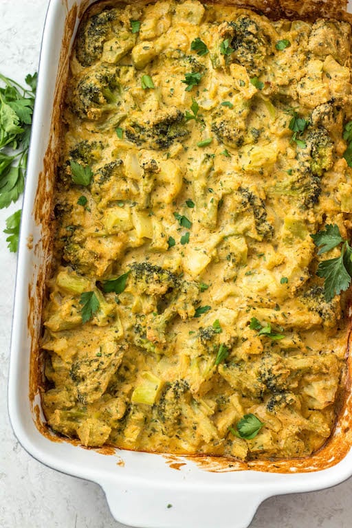 This healthy broccoli casserole recipe is perfect for an easy vegetable side dish for a weeknight dinner, or for a family holiday gathering like Easter! It's keto, Paleo, dairy free, Whole30 and vegetarian, so everyone can enjoy. It can be made with fresh broccoli, or is a great way to use frozen broccoli! The dairy free cheese sauce is quick to make, creamy and delicious! #healthybroccolicasserole #healthyeasterrecipes #dairyfree #whole30 #vegetablerecipes