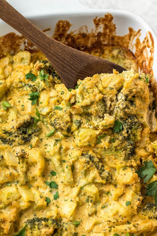 This healthy broccoli casserole recipe is perfect for an easy vegetable side dish for a weeknight dinner, or for a family holiday gathering like Easter! It's keto, Paleo, dairy free, Whole30 and vegetarian, so everyone can enjoy. It can be made with fresh broccoli, or is a great way to use frozen broccoli! The dairy free cheese sauce is quick to make, creamy and delicious! #healthybroccolicasserole #healthyeasterrecipes #dairyfree #whole30 #vegetablerecipes