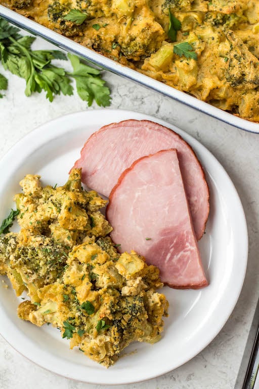 This healthy broccoli casserole recipe is perfect for an easy vegetable side dish for a weeknight dinner, or for a family holiday gathering like Easter! It's keto, Paleo, dairy free, Whole30 and vegetarian, so everyone can enjoy. It can be made with fresh broccoli, or is a great way to use frozen broccoli! The dairy free cheese sauce is quick to make, creamy and delicious! #healthybroccolicasserole #healthyeasterrecipes #dairyfree #whole30 #vegetablerecipes