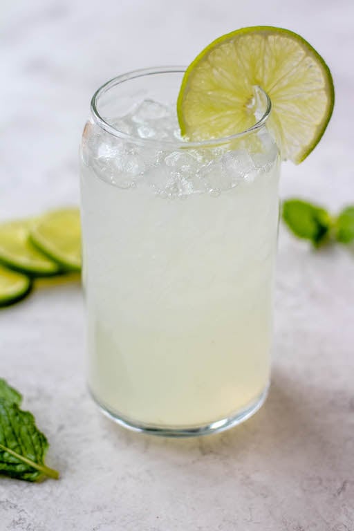 This lime juice recipe is refreshing, healthy and perfect for spring or summer! Known as limeade, this drink only uses a few simple ingredients, and can be made with fresh lime juice or bottled, sweetened or unsweetened! You'll love having this lime drink ready to go in the fridge to make drinking water more fun! #limejuice #limeade #limejuicerecipes #whole30drinks