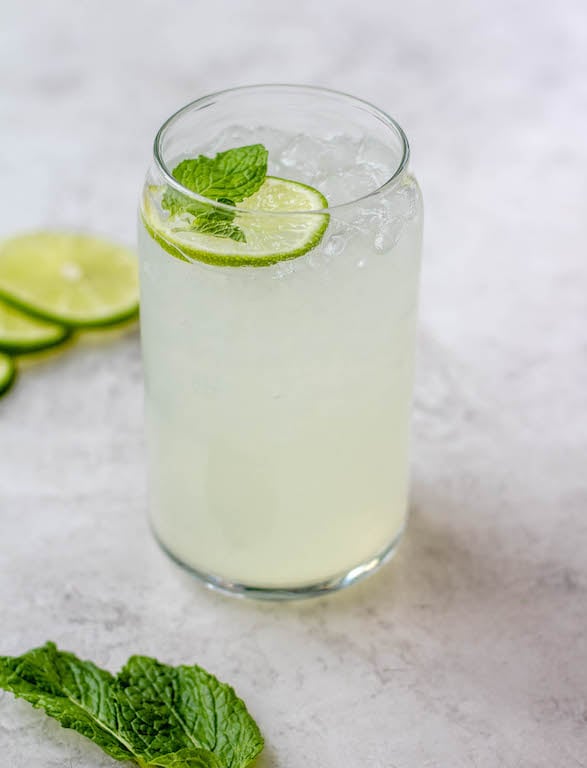 This lime juice recipe is refreshing, healthy and perfect for spring or summer! Known as limeade, this drink only uses a few simple ingredients, and can be made with fresh lime juice or bottled, sweetened or unsweetened! You'll love having this lime drink ready to go in the fridge to make drinking water more fun! #limejuice #limeade #limejuicerecipes #whole30drinks