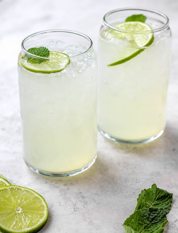 This lime juice recipe is refreshing, healthy and perfect for spring or summer! Known as limeade, this drink only uses a few simple ingredients, and can be made with fresh lime juice or bottled, sweetened or unsweetened! You'll love having this lime drink ready to go in the fridge to make drinking water more fun! #limejuice #limeade #limejuicerecipes #whole30drinks