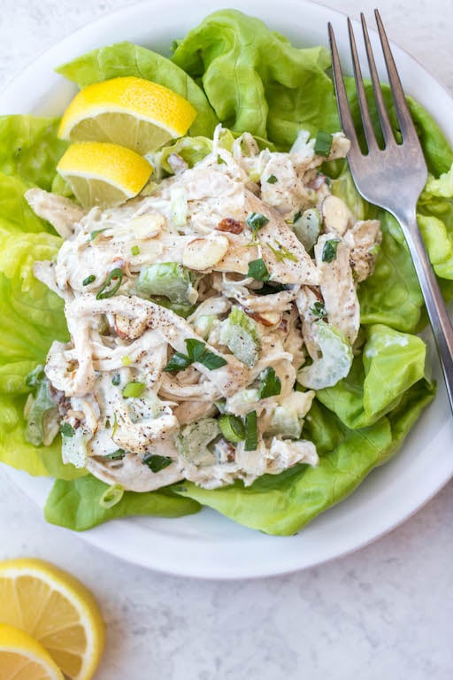 This easy shredded chicken salad recipe is so easy to make, and a great way to use leftover chicken or rotisserie chicken. It's made in under 20 minutes, with fewer than 10 ingredients and is awesome for lunch meal prep or shredded chicken salads. This salad is also Whole30, gluten free, dairy free, paleo and keto. #shreddedchickensalad #whole30chickensalad