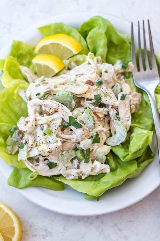 This easy shredded chicken salad recipe is so easy to make, and a great way to use leftover chicken or rotisserie chicken. It's made in under 20 minutes, with fewer than 10 ingredients and is awesome for lunch meal prep or shredded chicken salads. This salad is also Whole30, gluten free, dairy free, paleo and keto. #shreddedchickensalad #whole30chickensalad