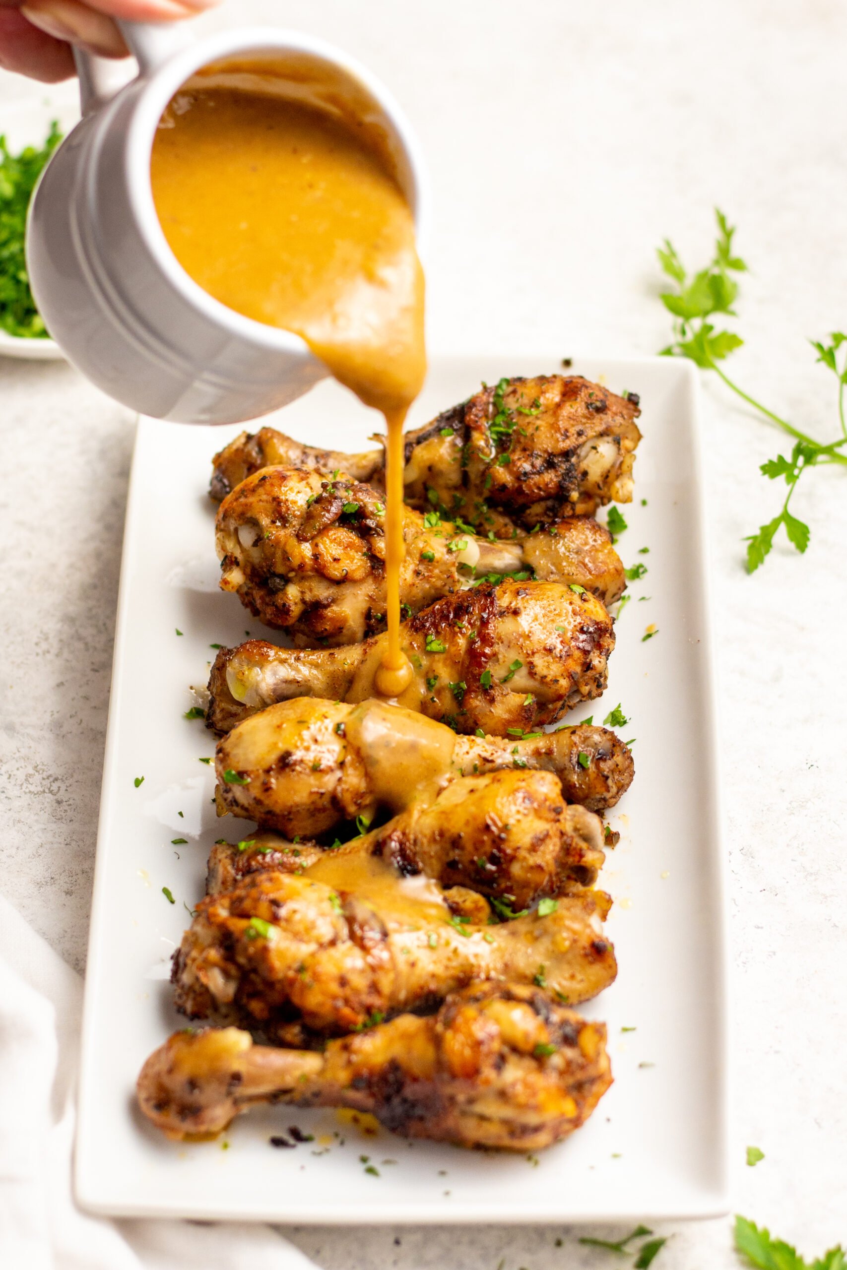 These instant pot chicken drumsticks are a fast way to get perfect chicken drumsticks without a lot of mess. They are both gluten and dairy free and are absolutely delicious. The homemade gravy makes this recipe perfect for a classic chicken and mashed potato meal the whole family will love, plus it's Whole30, paleo and low carb! This 30 minute, no mess instant pot chicken is sure to be a hit! #healthyrecipes #glutenfreerecipes #dairyfreerecipes #whole30recipes #glutenfreedairyfreerecipes #healthychickenrecipes #chickendrumsticks