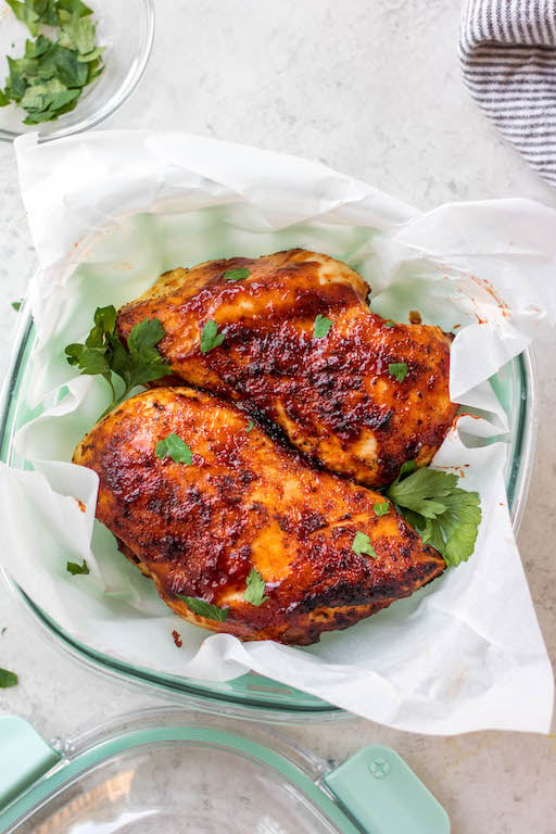 This air fryer BBQ chicken breast recipe is ideal for a quick weeknight dinner or healthy meal prep option for lunch! It's Whole30, keto and low carb, and gluten-free! It's so easy to prepare and cooks in 20 minutes. Using just a few simple ingredients, including boneless chicken breast, garlic powder and BBQ sauce, this recipe comes out juicy and perfect every time! #airfryerchicken #whole30chicken