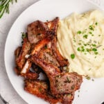 These air fryer lamb chops are among the easiest and fastest ways to get a delicious lamb entree on the table. They are both dairy free and gluten free, along with completely paleo and Whole30 lamb chops. This recipe goes with almost anything and takes 20 minutes from start to finish. Impress your friends and become a lamb chop expert overnight with this recipe! #glutenfreerecipes #dairyfreerecipes #glutenfreedairyfreerecipes #20minutemeals #whole30recipes #healthylambrecipes #airfryerrecipes