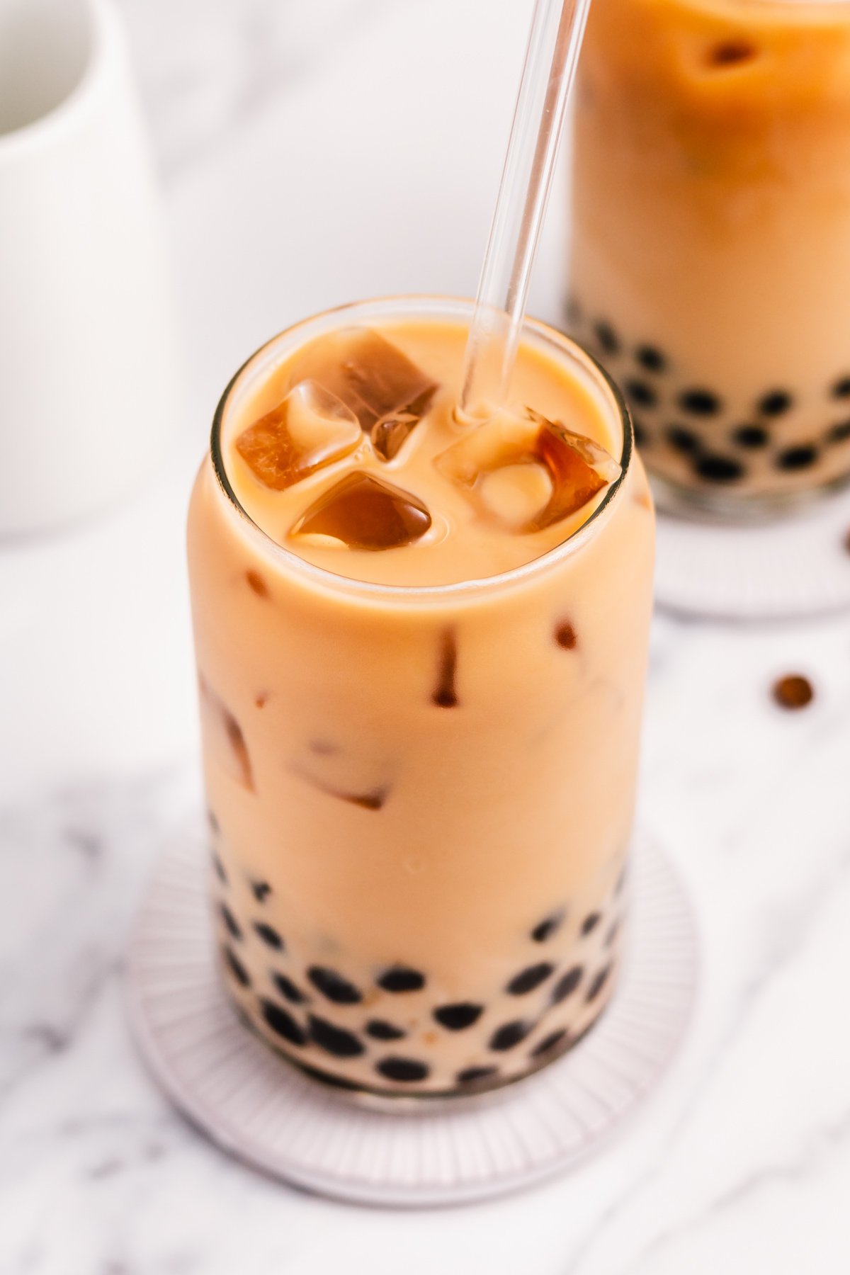 Boba coffee is naturally gluten free and can easily be dairy free as well. It uses only four ingredients to create a refreshing, visually appealing drink easily and quickly. Making your own bubble coffee at home saves you money and this versatile recipe can be tuned to your personal taste and hits the spot anytime from breakfast into the evening. #bobacoffee #bubblecoffee #glutenfreerecipes #dairyfreerecipes #glutenfreedairyfreerecipes #healthybreakfastrecipes