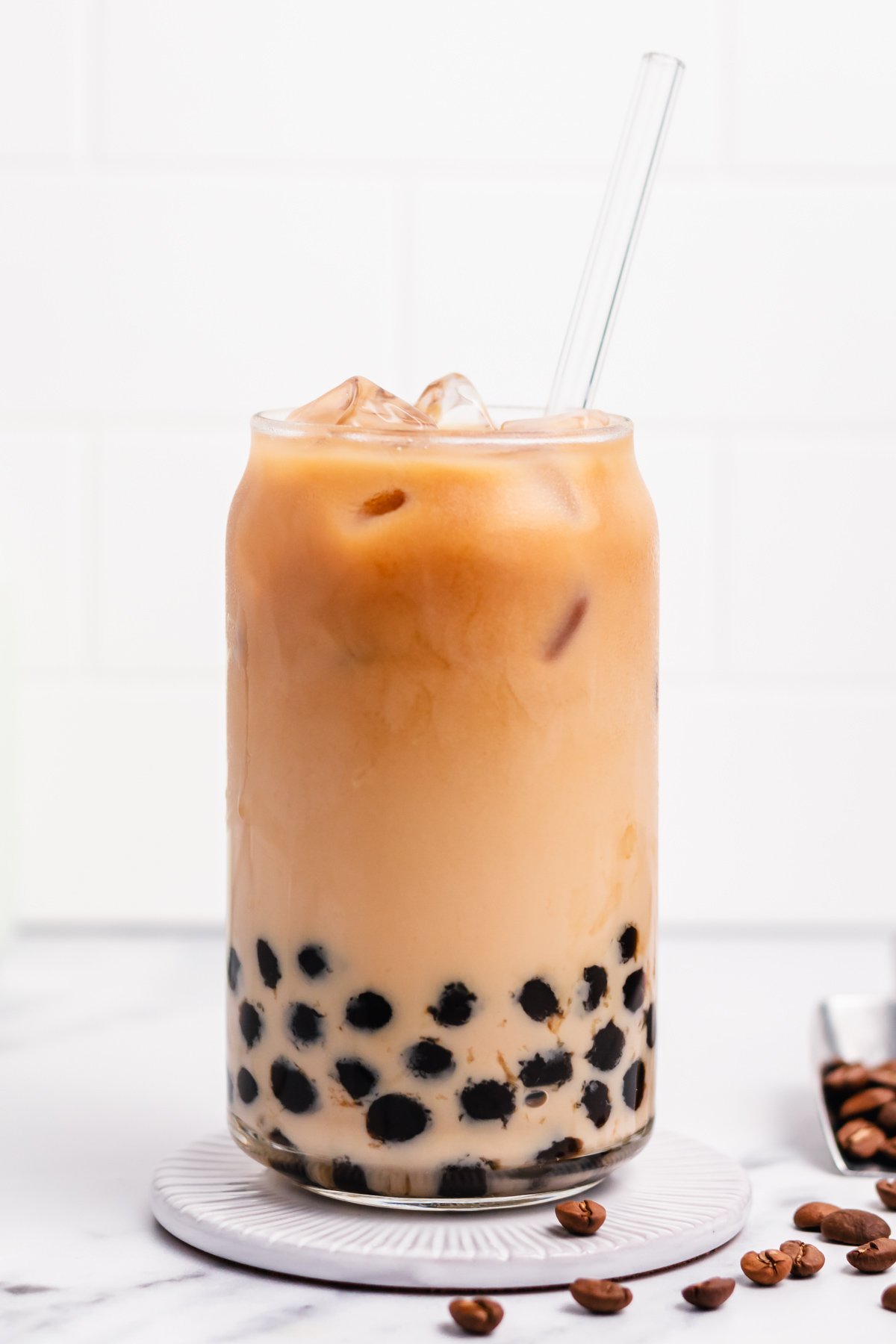 Boba coffee is naturally gluten free and can easily be dairy free as well. It uses only four ingredients to create a refreshing, visually appealing drink easily and quickly. Making your own bubble coffee at home saves you money and this versatile recipe can be tuned to your personal taste and hits the spot anytime from breakfast into the evening. #bobacoffee #bubblecoffee #glutenfreerecipes #dairyfreerecipes #glutenfreedairyfreerecipes #healthybreakfastrecipes