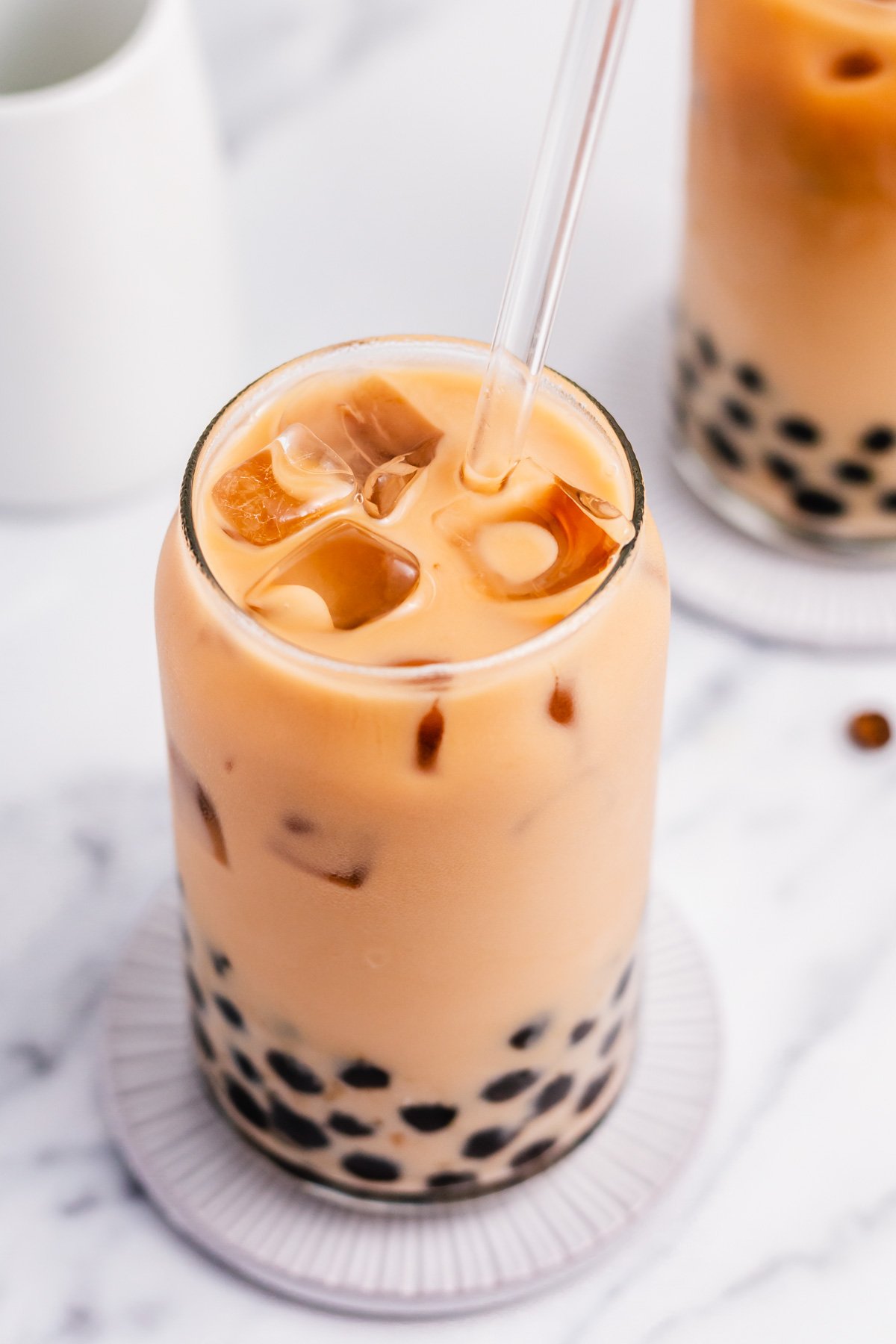 Boba coffee is naturally gluten free and can easily be dairy free as well. It uses only four ingredients to create a refreshing, visually appealing drink easily and quickly. Making your own bubble coffee at home saves you money and this versatile recipe can be tuned to your personal taste and hits the spot anytime from breakfast into the evening. #bobacoffee #bubblecoffee #glutenfreerecipes #dairyfreerecipes #glutenfreedairyfreerecipes #healthybreakfastrecipes