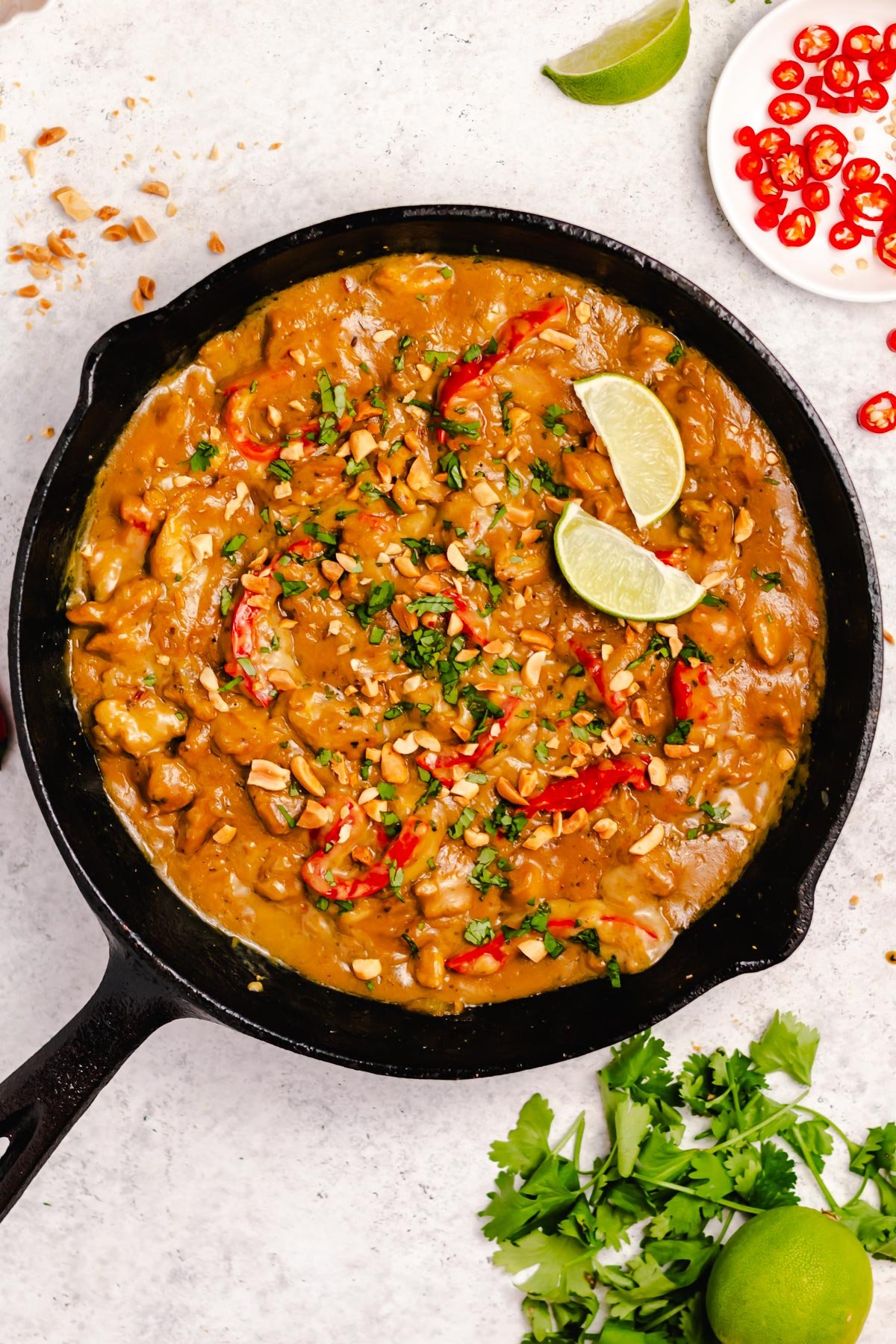 This peanut butter chicken skillet is a super easy one pot meal. It is naturally dairy free and gluten free and the combination of the spices, chicken, and peanut butter make for a hearty, fulfilling dish. It takes less than 20 minutes from start to finish for a dinner that the whole family will love! #dairyfreerecipes #glutenfreerecipes #glutenfreedairyfreerecipes #healthychickenrecipes #healthydinnerrecipes #30minutemeals