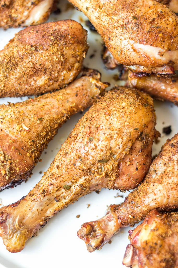 Having a go-to smoked chicken legs recipe is a must have for summer. These smoked chicken legs use very few staple ingredients and is gluten free and dairy free. It's the perfect choice for a gathering, or for meal prep because it is super easy and fast. Smoked chicken drumsticks are a favorite for kids and adults alike and will be a versatile addition to your summer smoking. #smokerrecipes #chickenlegs #glutenfreerecipes #dairyfreerecipes #smokedchickenlegs #chickendrumsticks